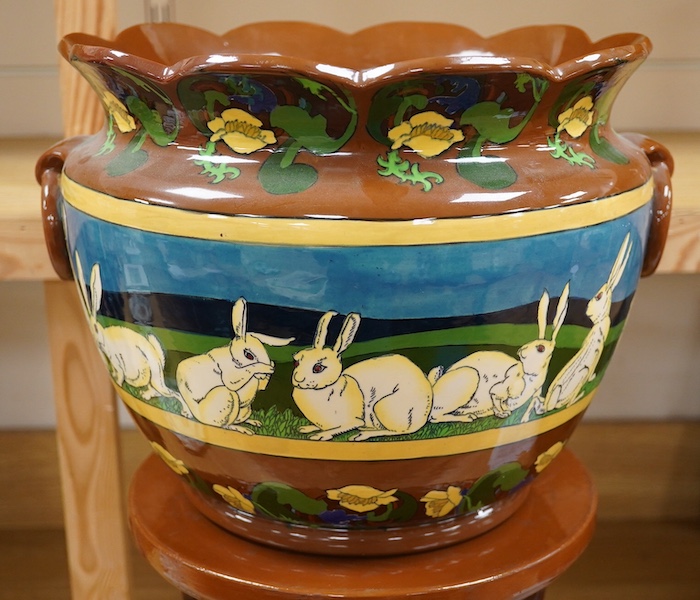 A large Foley Intarsio jardiniere on stand, designed by Frederick Rhead, decorated with rabbits, 60cm high. Condition - restored